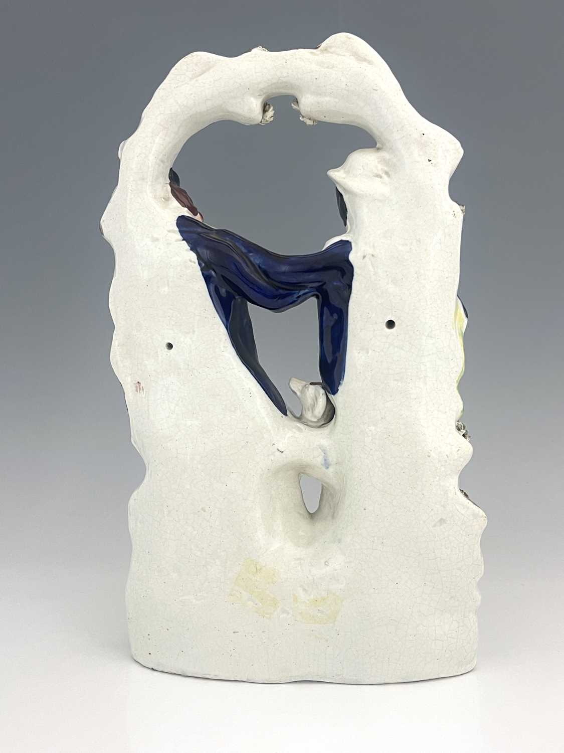 A Staffordshire ceramic flatback group of gentlemen in a scuffle, circa 1850