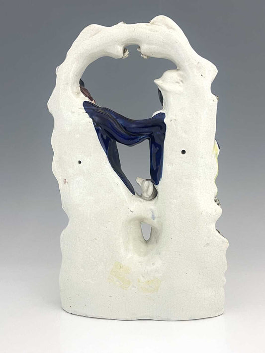 A Staffordshire ceramic flatback group of gentlemen in a scuffle, circa 1850