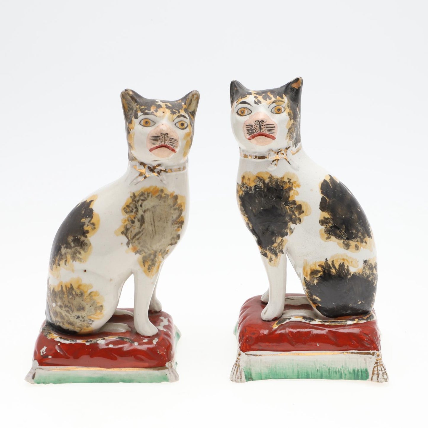 A pair of Staffordshire ceramic cats, circa 1860