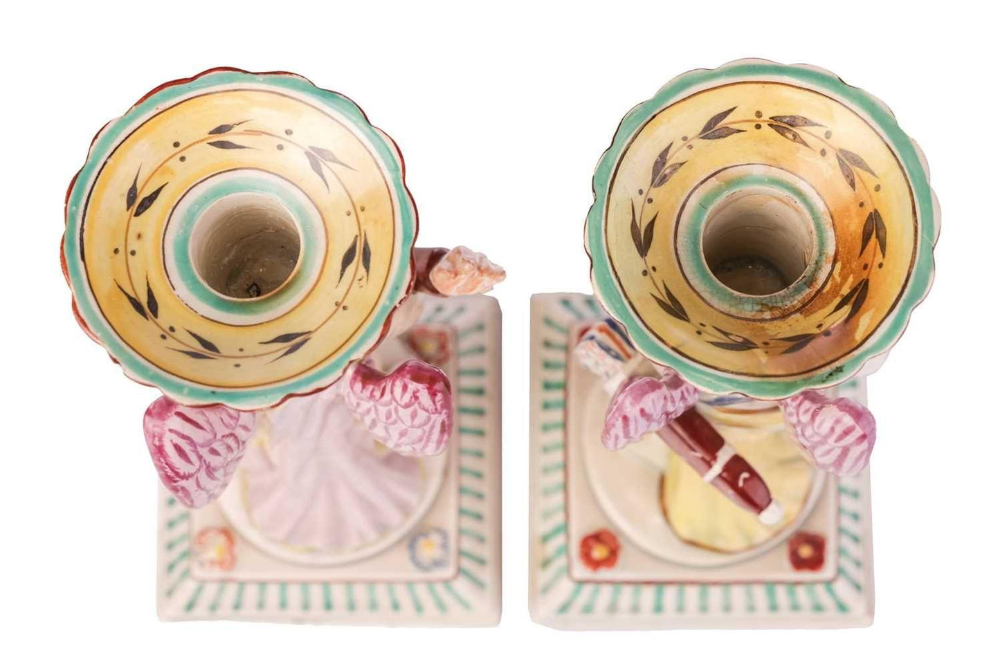 A Pair Of Early Staffordshire Ceramic Candlesticks Shaped As Putti, circa 1800