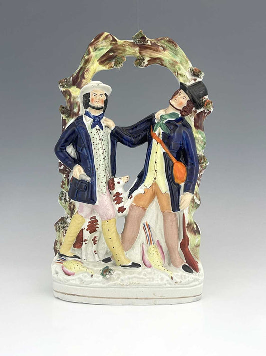 A Staffordshire ceramic flatback group of gentlemen in a scuffle, circa 1850